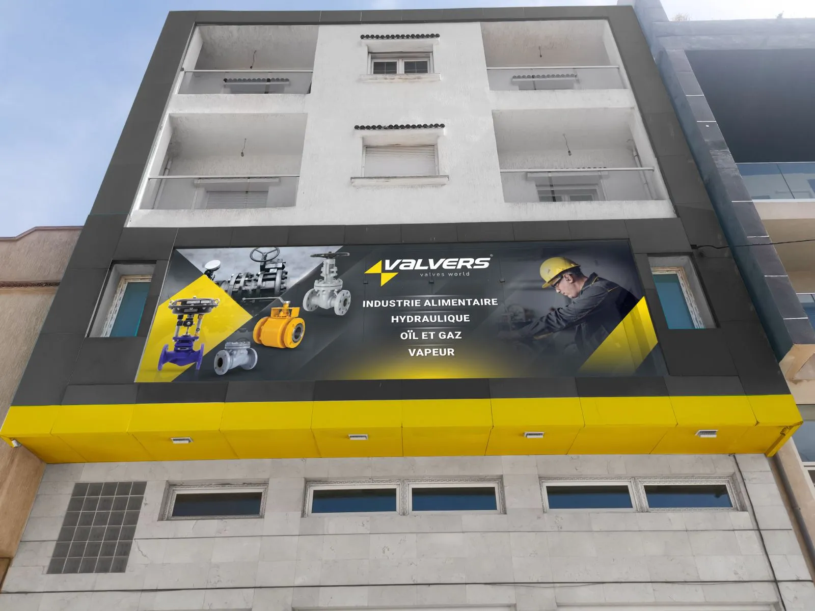 Valvers storefront sign shown on the building facade